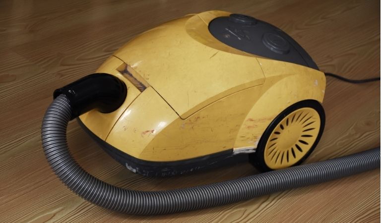broken yellow vacuum cleaner