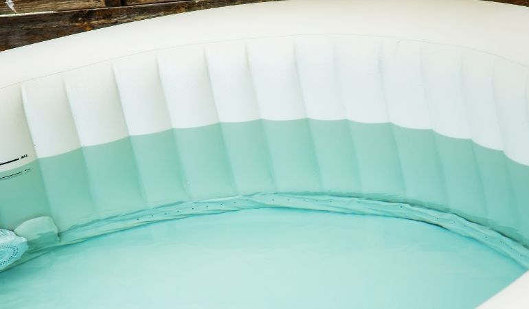under base of inflatable hot tub