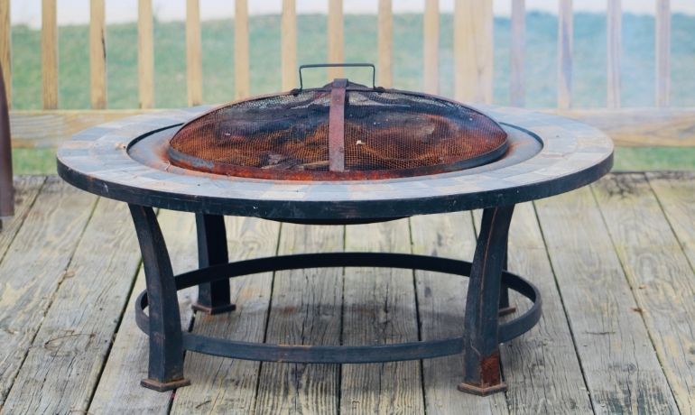 fire pit placed on wood deck