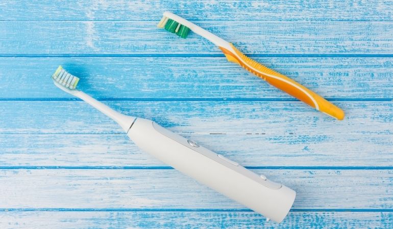 plastic toothbrush and sonic toothbrush